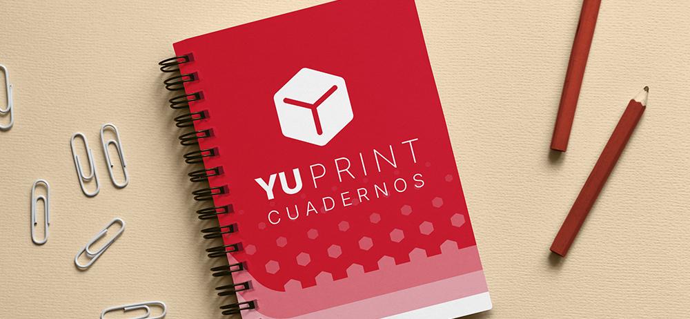 Cuaderno Yuprint con espiral y portada roja decorativa, ideal para oficina, estudio y material promocional.